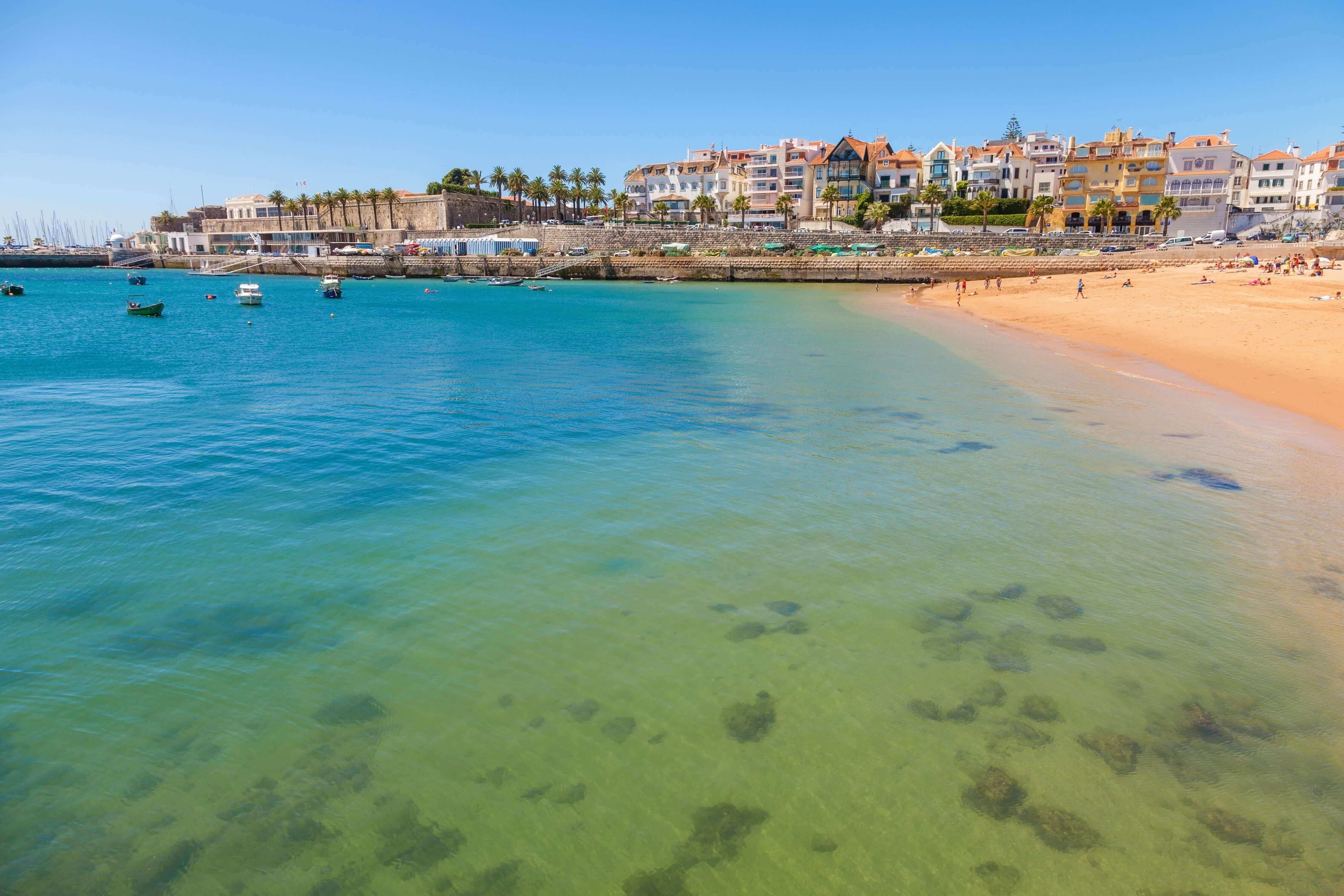 Beach, town and dock of Cascais at summer, Portugal